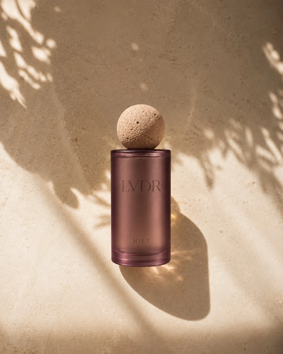 LVDR Lavender Haze mist in frosted violet glass with a travertine sphere cap